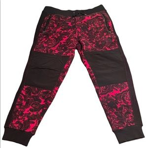 The North Face 94 Rage Fleece Pant in rose red rage print sweatpants